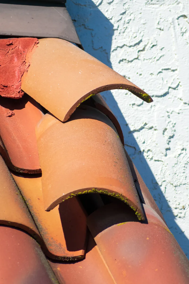 Clay ridge tiles at the end of a roof ridge