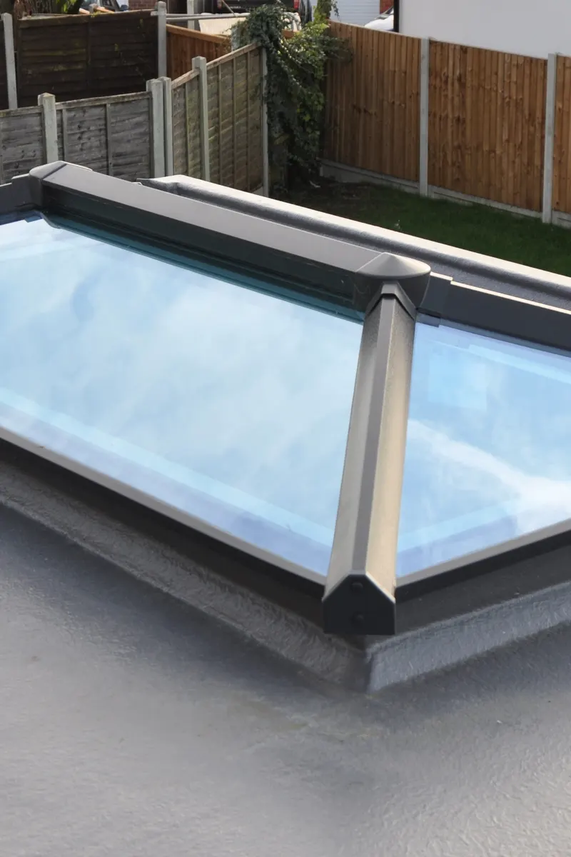 A fibreglass flat roof with a glass roof lantern